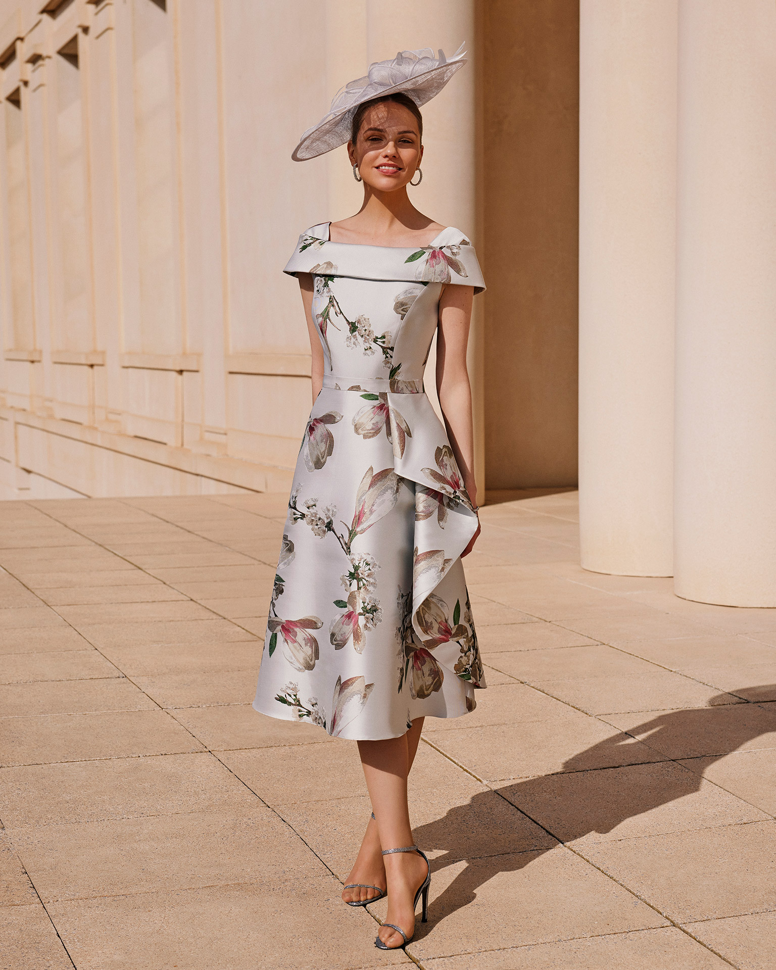 Short cocktail dress, made of brocade. Couture Club design with a wraparound neckline, and a handkerchief skirt. MARFIL_BARCELONA.