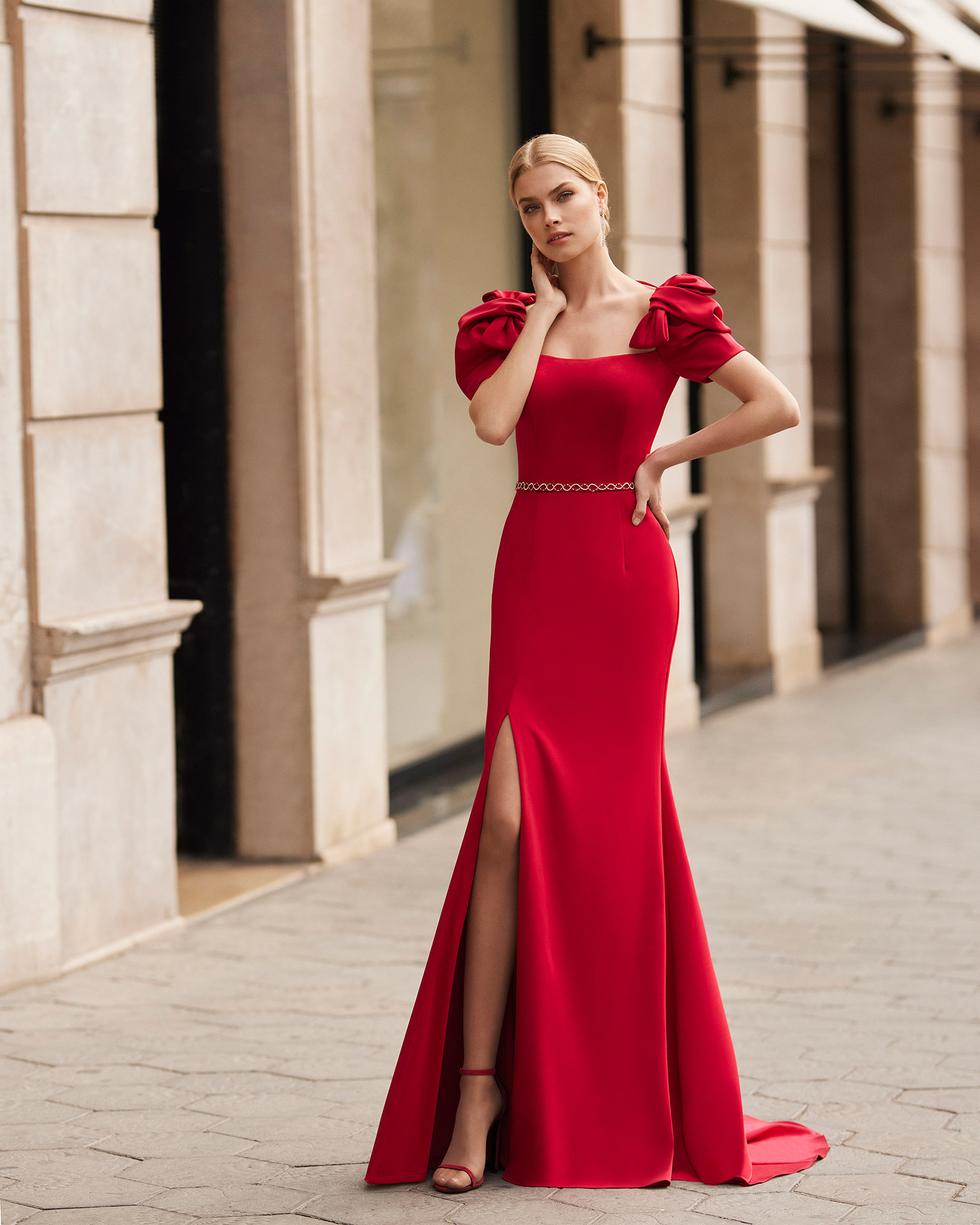 Elegant sheath-style long evening dress, made of satin crepe. Marfil Barcelona design with a strapless neckline, a beadwork belt, and short puffed sleeves. MARFIL_BARCELONA.