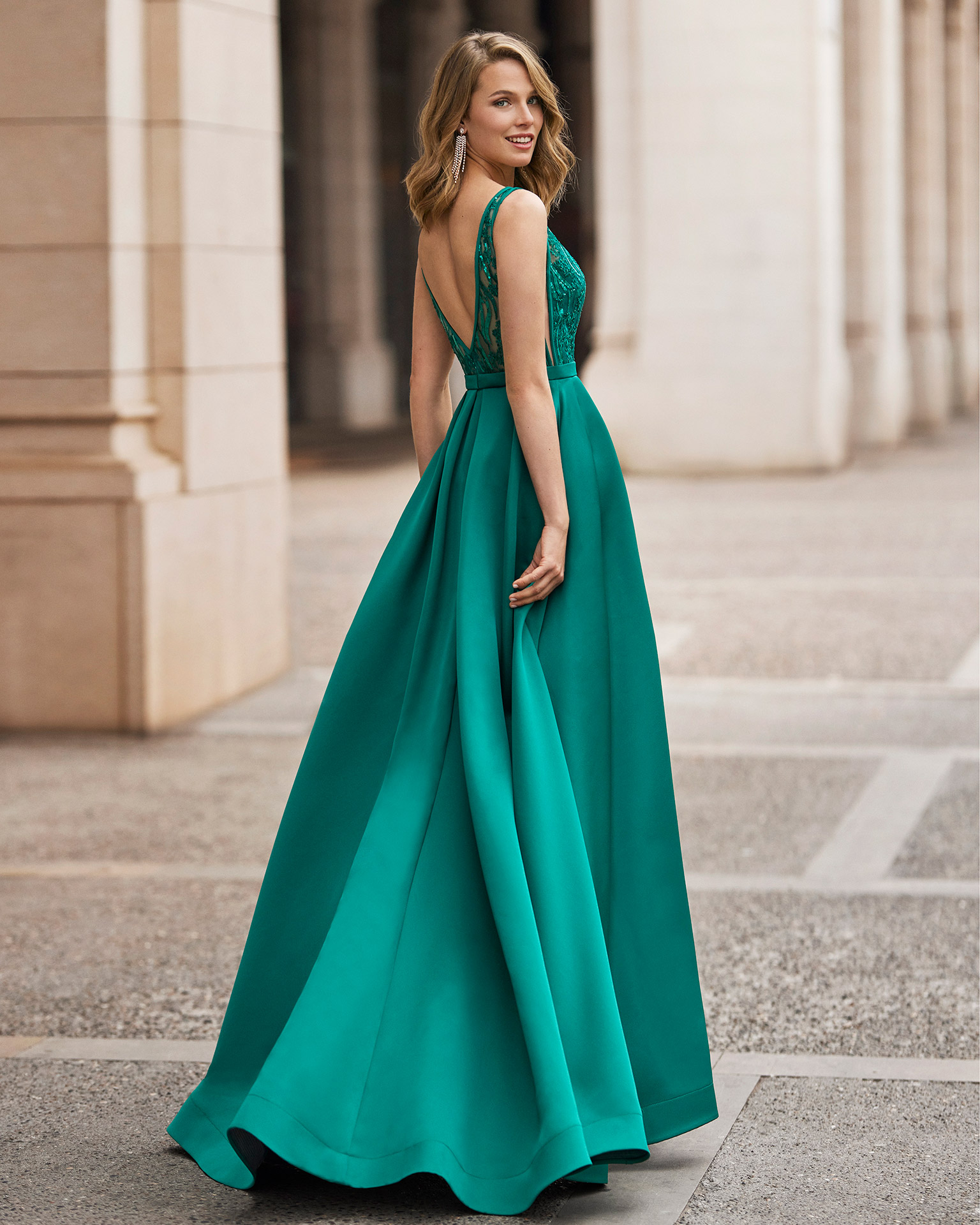 Classic long evening dress, made of satin. Marfil Barcelona design with a beaded lace bodice, a belt, and a pleated skirt. MARFIL_BARCELONA.