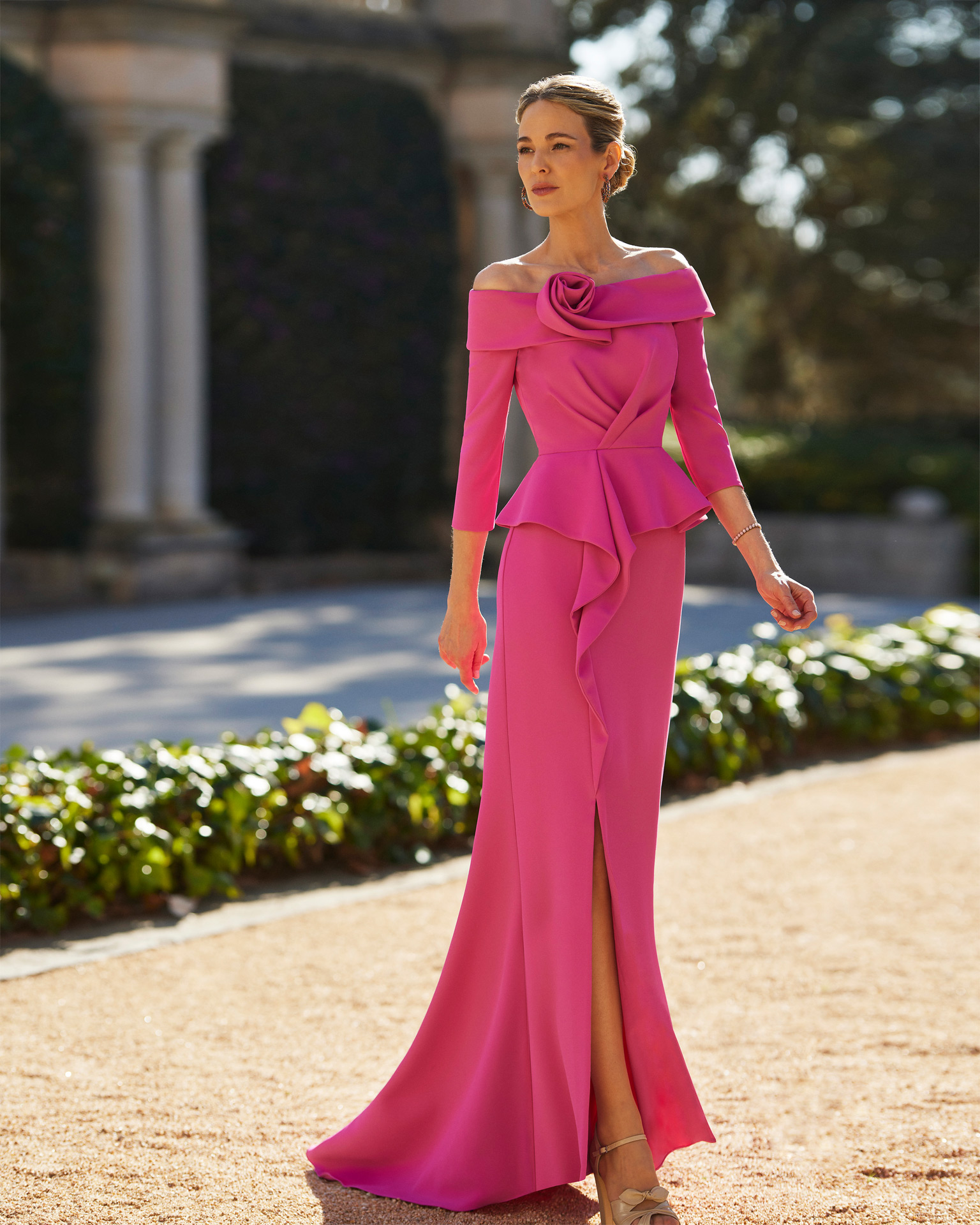 Elegant long cocktail dress. Crafted in crêpe. With off-the-shoulder neckline and three-quarter sleeves with side slit. Couture Club design. MARFIL_BARCELONA.