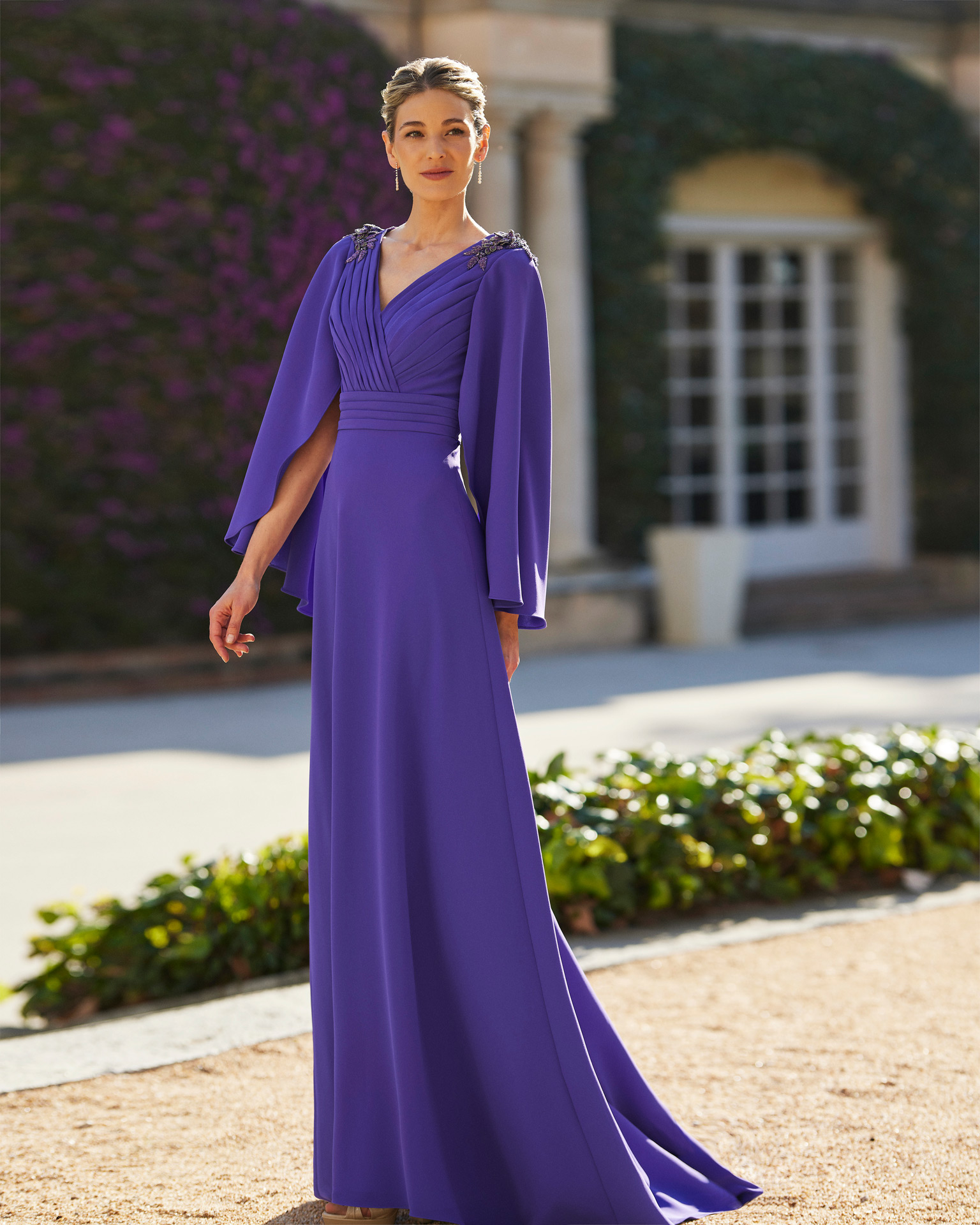 Long guest dress. Crafted in crêpe with beadwork details. With V-neckline, plunging back and butterfly sleeves. Couture Club design. MARFIL_BARCELONA.