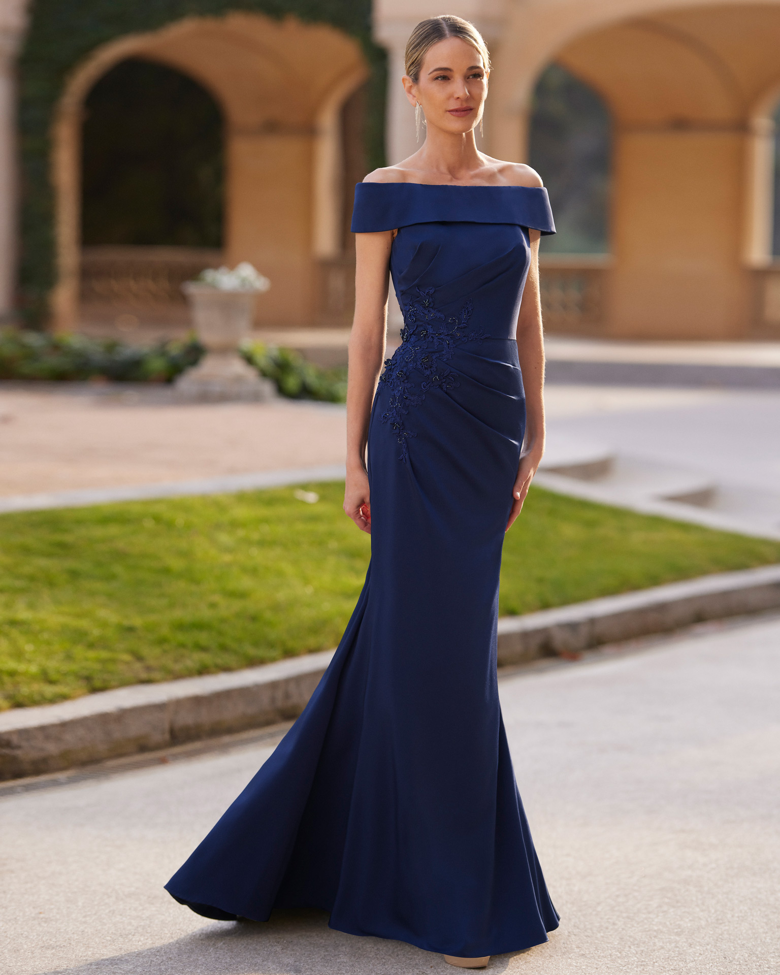 Simple long cocktail dress. Crafted in sateen crêpe with beadwork details. With off-the-shoulder neckline. Couture Club look. MARFIL_BARCELONA.