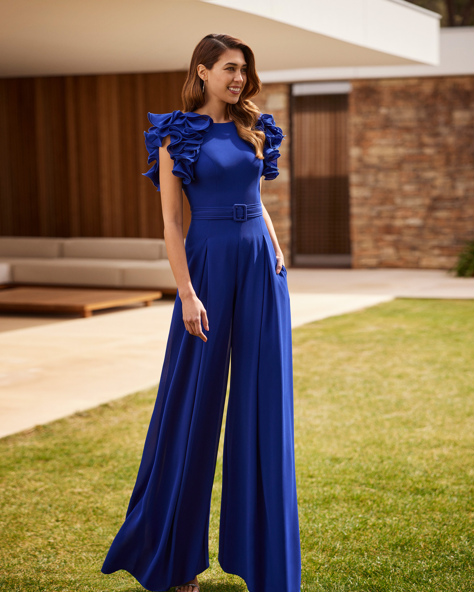 Simple long evening jumpsuit. Made with crêpe. With round neckline, teardrop back and straps with ruffles. Exclusive Marfil Barcelona look. MARFIL_BARCELONA.