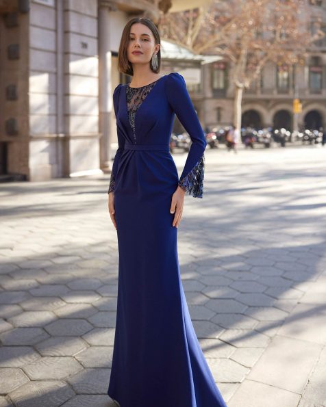 Classic long mother-of-the-bride dress, crafted in stretch crêpe embellished with beadwork. Featuring a bateau neckline, beadwork back and long sleeve. A Marfil Barcelona design. MARFIL_BARCELONA.