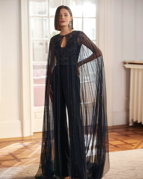 Two-piece long evening dress, made in chiffon with beadwork. Featuring a V-neckline and V-back, straps, and a cape with beadwork. A Marfil Barcelona look. MARFIL_BARCELONA.