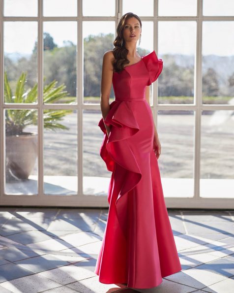 Long evening dress made in satin. Featuring an asymmetric neckline, open back and flounced sleeveless bodice. A Marfil Barcelona look. MARFIL_BARCELONA.