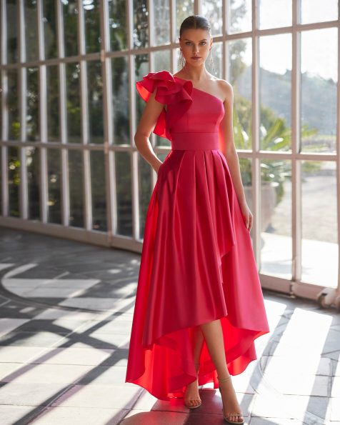 Long evening dress made in satin. Featuring a flounced sleeveless bodice with an asymmetric neckline, keyhole back, and asymmetric skirt with pockets. A Marfil Barcelona look. MARFIL_BARCELONA.
